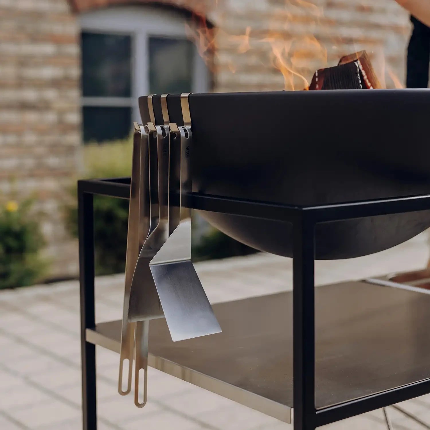 Höfats Grill Tool Set consisting of grill tongs, grill scraper, and spatula