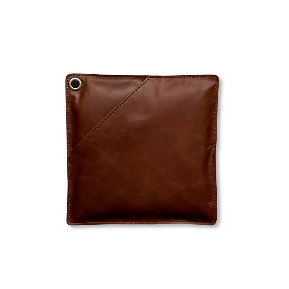 Pot holder in dark brown leather, offering heat protection and comfort for handling hot cookware