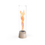 Höfats SPIN Air 1200 - Sand-colored tabletop bioethanol fireplace with tall cylindrical glass.