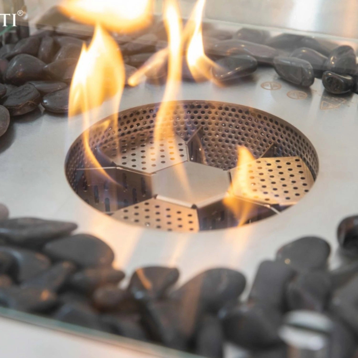 Aurora bioethanol fire pit in matte black with glass windscreen and bronze fire glass