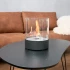 chimenea de mesa y sobre mesa de forma circular