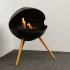 Chimenea de bioetanol circular independiente con tres patas de madera de roble